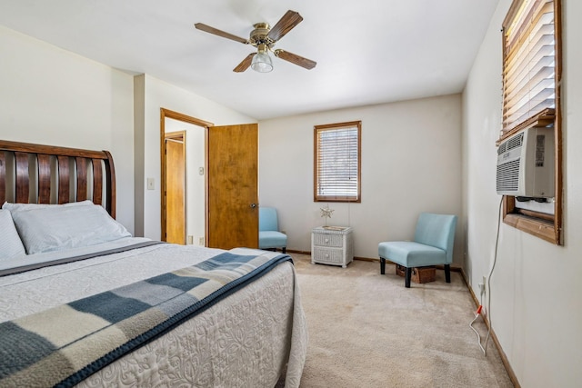bedroom featuring light carpet, cooling unit, baseboards, and a ceiling fan