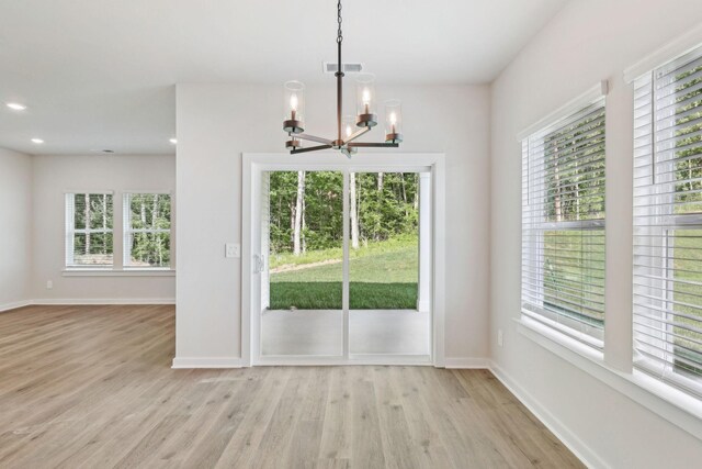 708 Brody Ct, Antioch, TN 37013 - unfurnished dining area with a chandelier, plenty of natural light, light wood-style floors, and recessed lighting