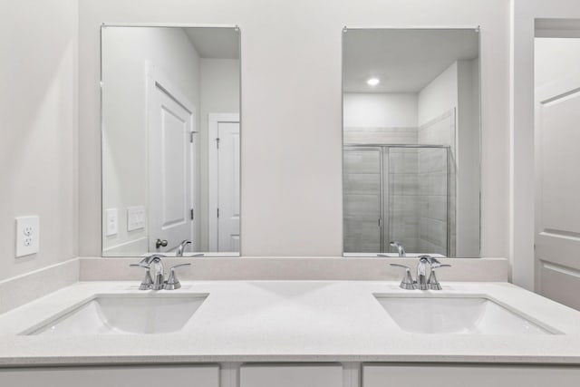 708 Brody Ct, Antioch, TN 37013 - bathroom with double vanity, a stall shower, and recessed lighting