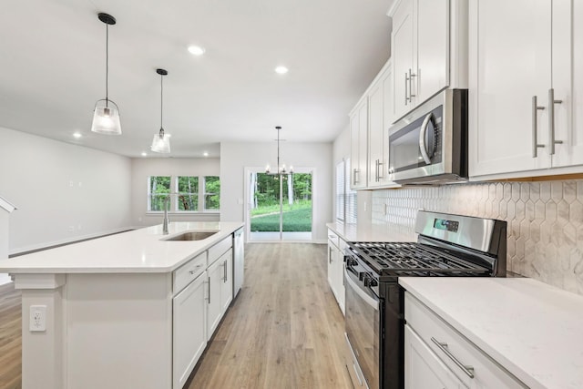 708 Brody Ct, Antioch, TN 37013 - kitchen featuring appliances with stainless steel finishes, light wood-style flooring, backsplash, light countertops, and recessed lighting