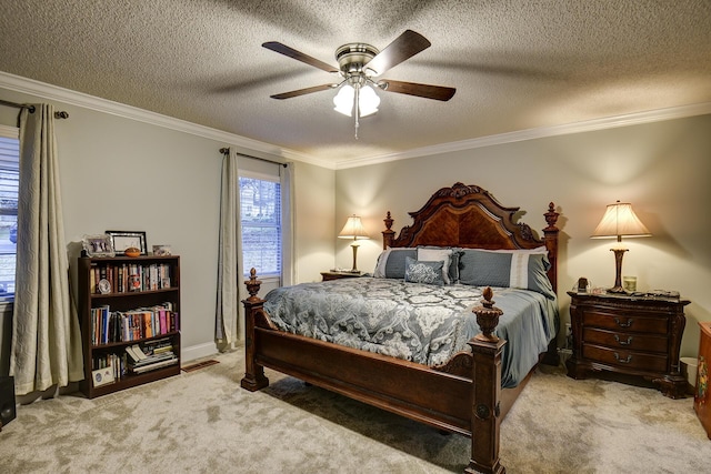 carpeted bedroom with visible vents, a textured ceiling, crown molding, and a ceiling fan
