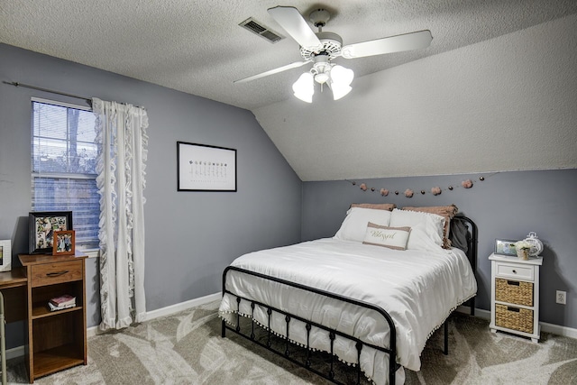 carpeted bedroom with visible vents, baseboards, ceiling fan, lofted ceiling, and a textured ceiling