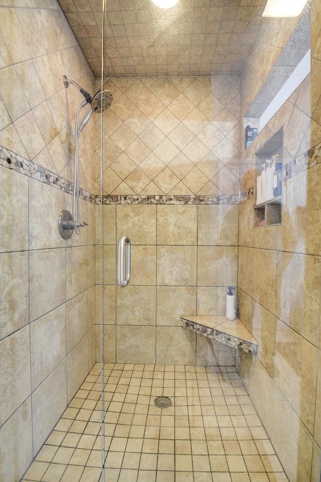 bathroom with a shower stall