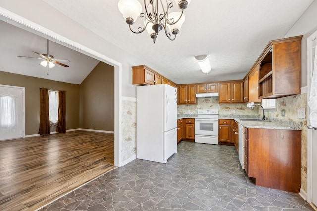 kitchen featuring a sink, open floor plan, brown cabinetry, under cabinet range hood, and white appliances