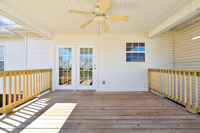 wooden deck featuring ceiling fan and french doors
