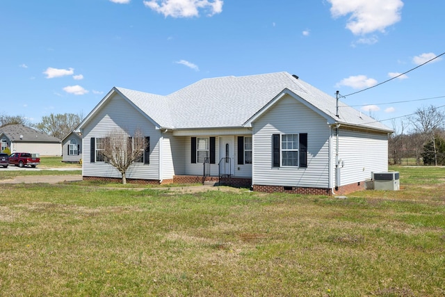ranch-style house with a shingled roof, central air condition unit, a front lawn, and crawl space