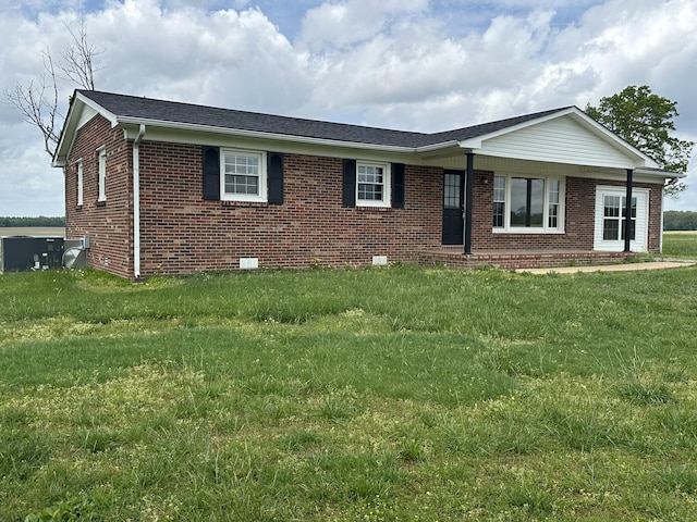 59 Overnack Rd, Lawrenceburg, TN 38464 - single story home featuring brick siding, central AC unit, and a front yard