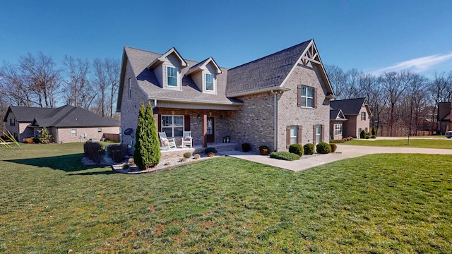5020 E Mayflower Ct, Greenbrier, TN 37073 - view of front of house featuring brick siding and a front yard