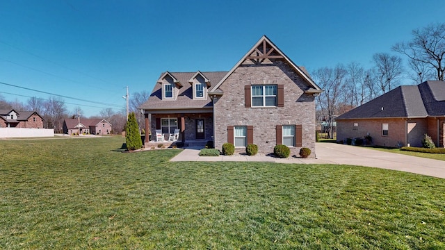 5020 E Mayflower Ct, Greenbrier, TN 37073 - view of front of property with brick siding, covered porch, and a front yard