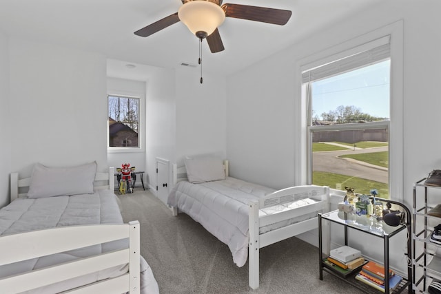 5020 E Mayflower Ct, Greenbrier, TN 37073 - bedroom with visible vents, multiple windows, ceiling fan, and carpet flooring