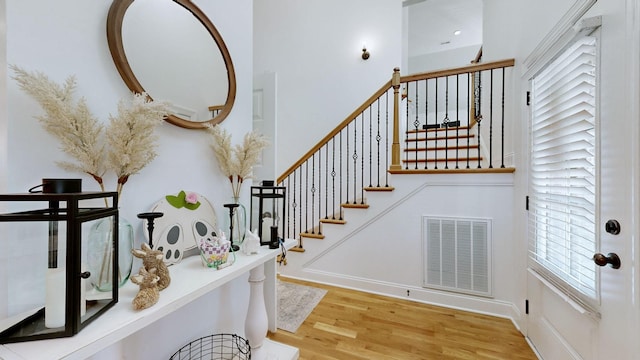 5020 E Mayflower Ct, Greenbrier, TN 37073 - stairs featuring visible vents, baseboards, and wood finished floors