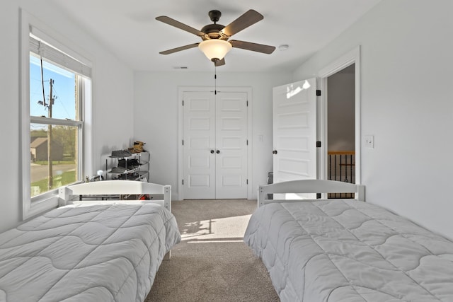 5020 E Mayflower Ct, Greenbrier, TN 37073 - bedroom with a closet, visible vents, light colored carpet, and ceiling fan