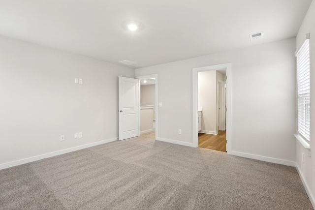 4228 Skyridge Dr, Nashville, TN 37207 - unfurnished bedroom featuring baseboards, carpet flooring, ensuite bath, and visible vents