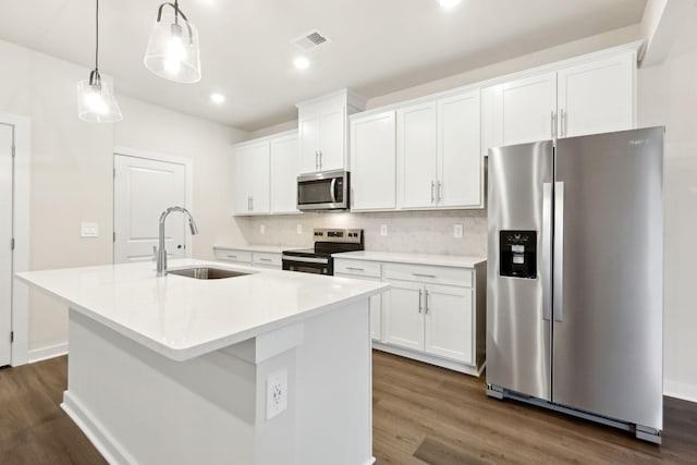 4228 Skyridge Dr, Nashville, TN 37207 - kitchen with white cabinetry, stainless steel appliances, a kitchen island with sink, and a sink