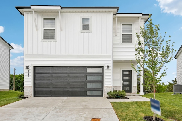 4228 Skyridge Dr, Nashville, TN 37207 - view of front of home featuring concrete driveway, an attached garage, a front lawn, and board and batten siding