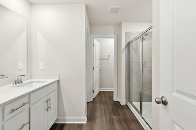 4228 Skyridge Dr, Nashville, TN 37207 - bathroom featuring a shower stall, wood finished floors, vanity, and baseboards