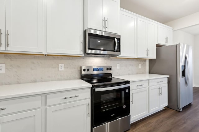 4228 Skyridge Dr, Nashville, TN 37207 - kitchen with appliances with stainless steel finishes, dark wood-style flooring, white cabinets, light countertops, and decorative backsplash