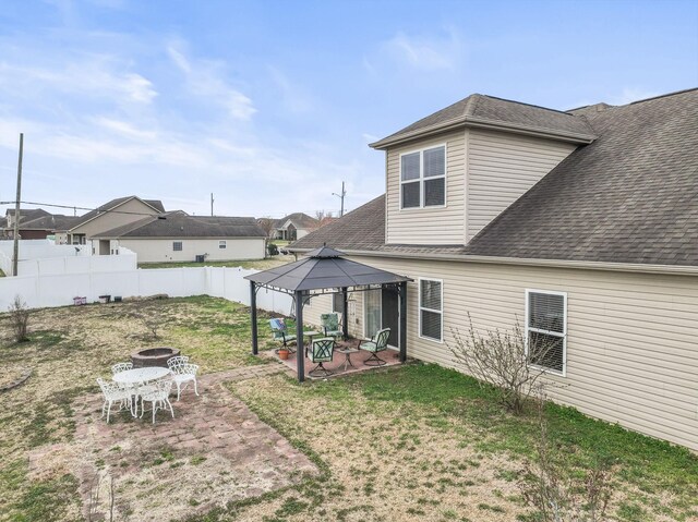 1060 Campbell Ave, Gallatin, TN 37066 - back of property with a gazebo, a patio area, fence, and a shingled roof