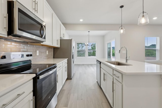 4220 Skyridge Dr, Nashville, TN 37207 - kitchen featuring stainless steel appliances, a sink, recessed lighting, decorative backsplash, and light countertops
