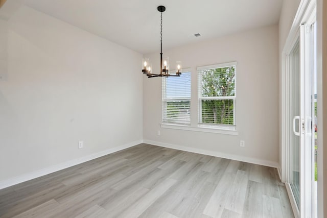 4220 Skyridge Dr, Nashville, TN 37207 - spare room with a chandelier, light wood finished floors, and baseboards