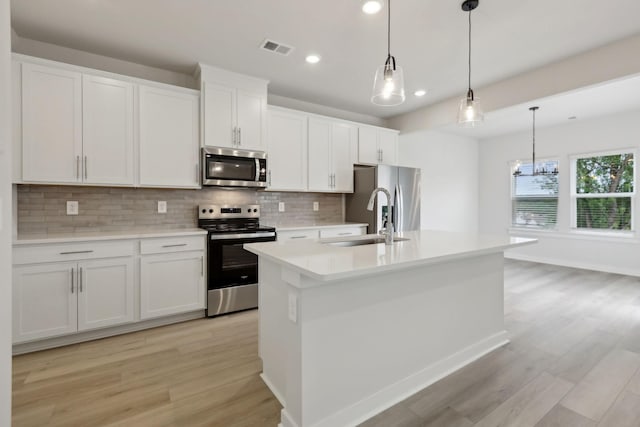 4220 Skyridge Dr, Nashville, TN 37207 - kitchen featuring stainless steel appliances, a sink, recessed lighting, light wood finished floors, and backsplash