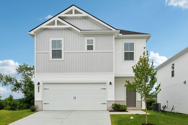 4220 Skyridge Dr, Nashville, TN 37207 - view of front of house featuring board and batten siding, concrete driveway, an attached garage, central AC unit, and a front lawn