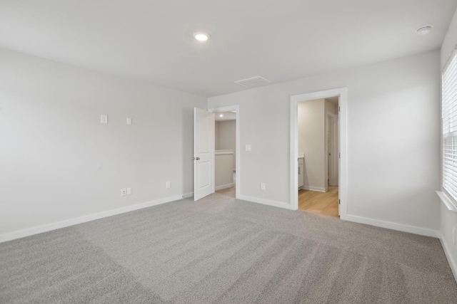 4220 Skyridge Dr, Nashville, TN 37207 - unfurnished bedroom with light colored carpet, baseboards, recessed lighting, and connected bathroom