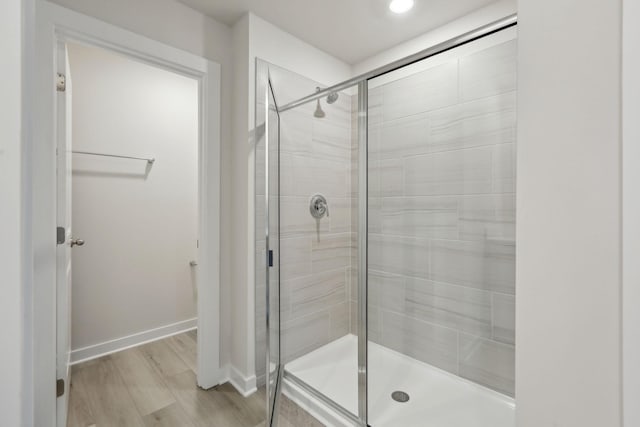 4220 Skyridge Dr, Nashville, TN 37207 - bathroom featuring a stall shower, baseboards, and wood finished floors