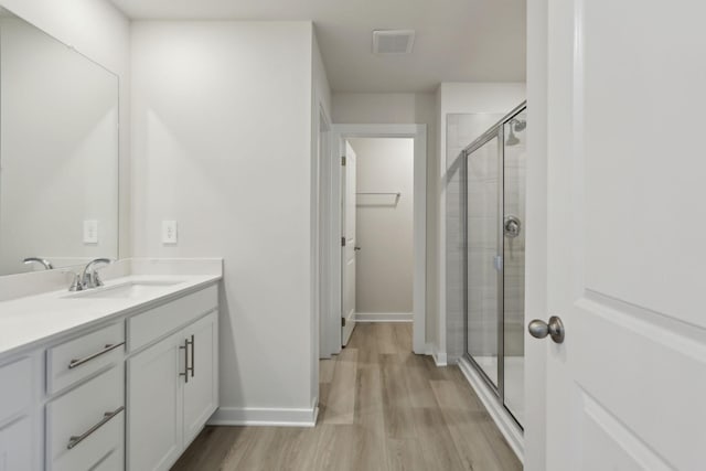 4220 Skyridge Dr, Nashville, TN 37207 - full bath featuring vanity, a shower stall, wood finished floors, and baseboards
