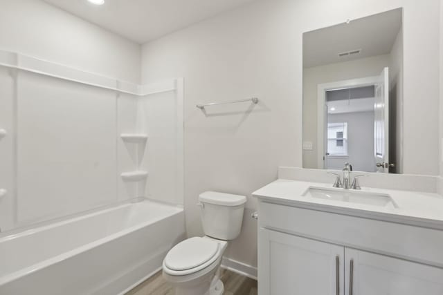 4220 Skyridge Dr, Nashville, TN 37207 - bathroom featuring vanity, wood finished floors, toilet, bathtub / shower combination, and baseboards