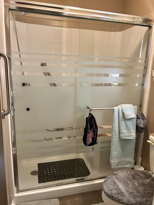 1306 Mcmahan St, Manchester, TN 37355 - full bathroom featuring a stall shower and toilet