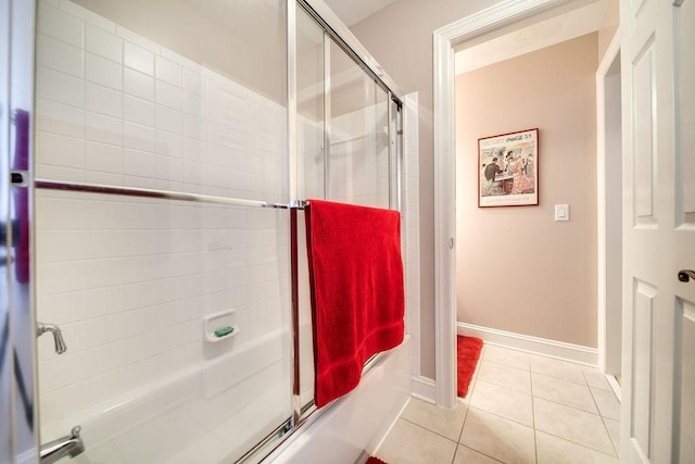908 Plantation Blvd, Gallatin, TN 37066 - full bathroom featuring tile patterned floors, enclosed tub / shower combo, and baseboards