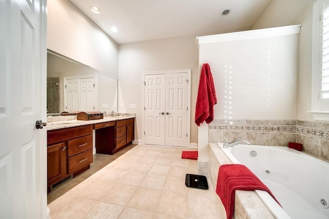 908 Plantation Blvd, Gallatin, TN 37066 - full bath with vanity, tile patterned floors, and a tub with jets