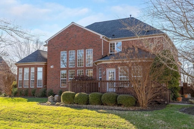 908 Plantation Blvd, Gallatin, TN 37066 - rear view of house with a yard, brick siding, and a shingled roof