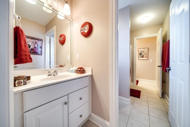 908 Plantation Blvd, Gallatin, TN 37066 - bathroom with tile patterned floors, vanity, and baseboards