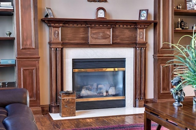 908 Plantation Blvd, Gallatin, TN 37066 - room details with baseboards, wood finished floors, and a high end fireplace