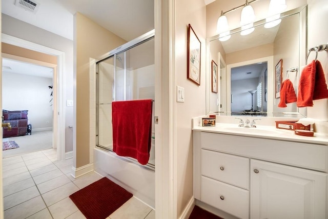 908 Plantation Blvd, Gallatin, TN 37066 - full bathroom featuring tile patterned floors, visible vents, baseboards, enclosed tub / shower combo, and vanity