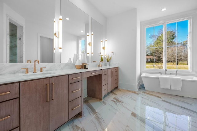 bathroom featuring double vanity, a soaking tub, recessed lighting, a sink, and marble finish floor
