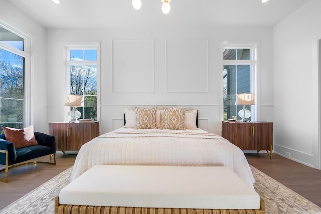bedroom featuring recessed lighting, baseboards, and wood finished floors