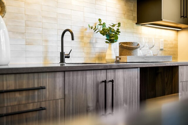 kitchen with backsplash and modern cabinets