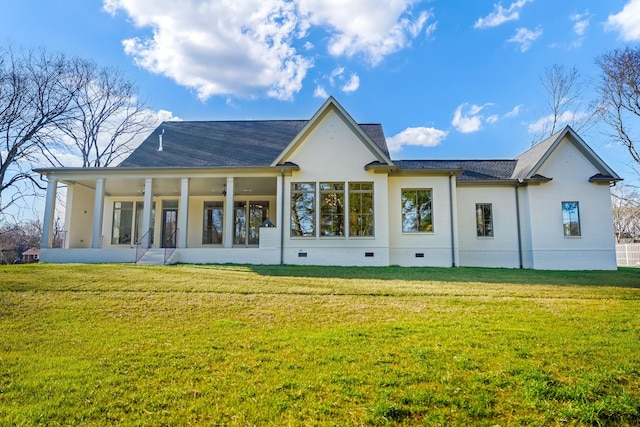rear view of house featuring crawl space, a yard, roof with shingles, and a sunroom