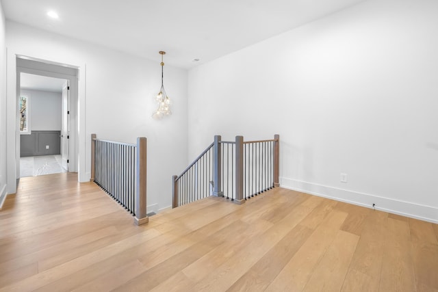 unfurnished room featuring light wood-style flooring, recessed lighting, and baseboards