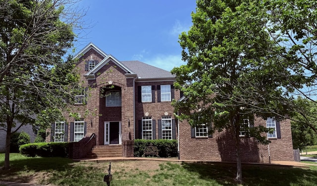1412 Leeds Dr E, Franklin, TN 37067 - view of front facade featuring brick siding and a front lawn