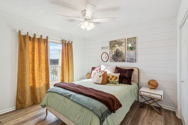 144 Tanasi Shr, Gallatin, TN 37066 - bedroom featuring ceiling fan, a textured ceiling, and wood finished floors