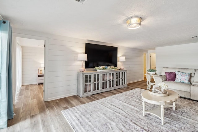 144 Tanasi Shr, Gallatin, TN 37066 - living area with baseboards, a textured ceiling, and wood finished floors