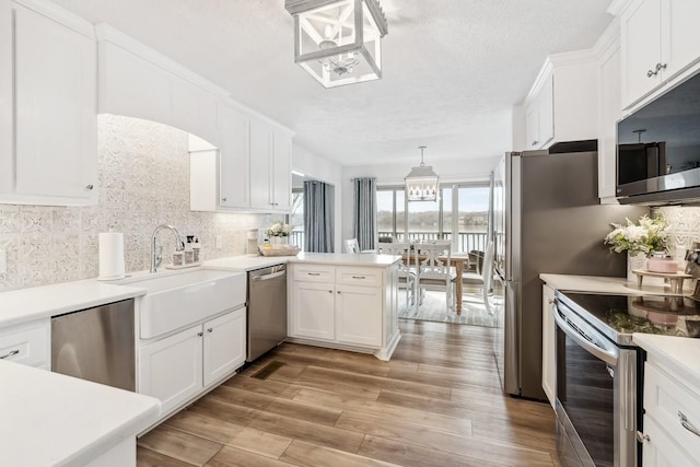 144 Tanasi Shr, Gallatin, TN 37066 - kitchen with tasteful backsplash, white cabinetry, stainless steel appliances, and a sink