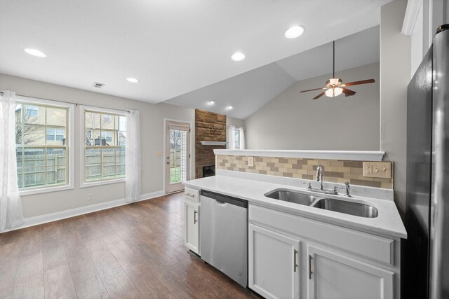 568 Tracy Ln, Clarksville, TN 37040 - kitchen with stainless steel appliances, a ceiling fan, dark wood-style floors, light countertops, and white cabinetry