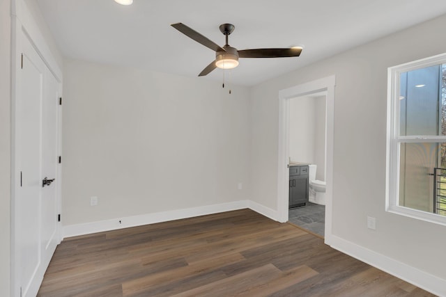 1016 W Kirkland Ave Unit C, Nashville, TN 37216 - unfurnished bedroom featuring ceiling fan, baseboards, dark wood-style floors, and ensuite bathroom