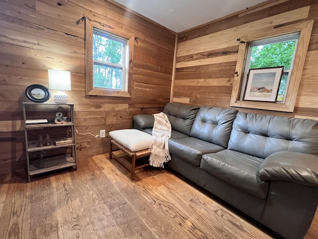living room with wooden walls and wood finished floors