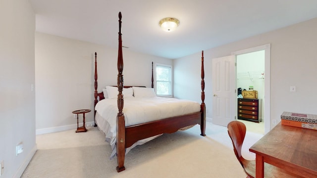 bedroom with carpet flooring and baseboards